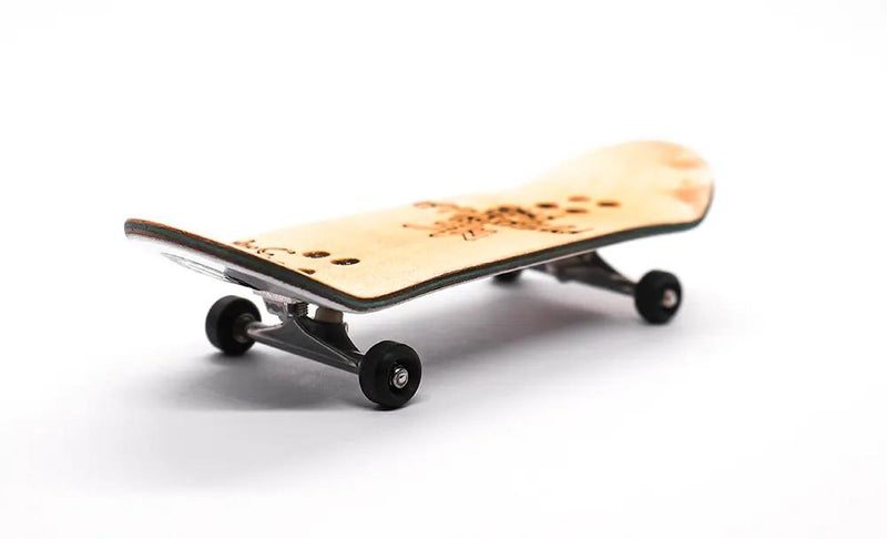 Mike FB x Caramel Screaming Fingaz 34mm complete fingerboard with natural wood deck and glow-in-the-dark graphic.
