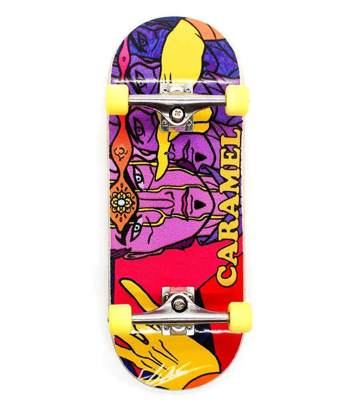 Street x Caramel Doctor Strange 34mm fingerboard with vibrant purple, red, and yellow graphic, yellow wheels.