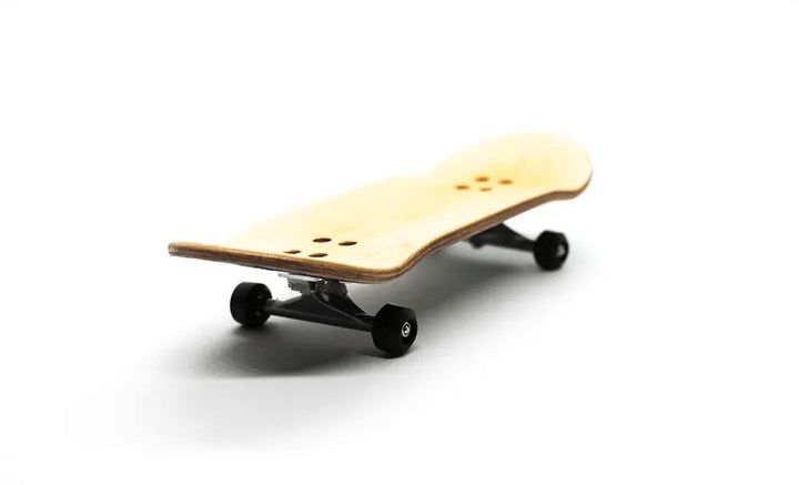 34mm light wood fingerboard with black Caramel trucks and CNC wheels, angled on a white background.