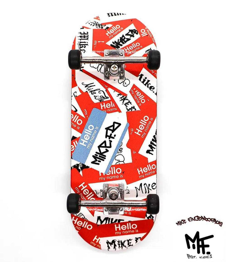 34mm Mike FB x Caramel Hello complete fingerboard with red and white "Hello my name is Mike" graphic.