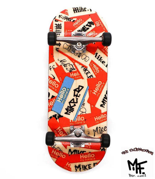 Mike FB x Caramel "Hello My Name" 34mm fingerboard with red and white sticker graphic, silver trucks, and black wheels.