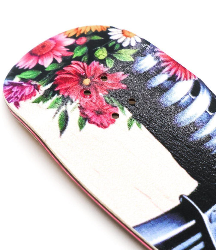 Kinkpin Bloomfire 34mm fingerboard deck with vibrant floral and skeleton graphic.