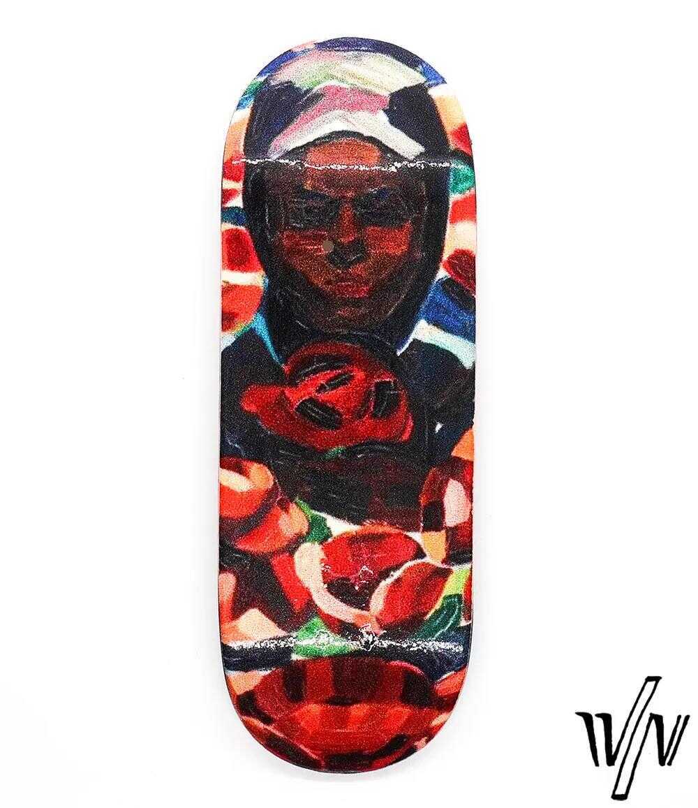 Von Zehos Woman 32mm fingerboard deck with colorful abstract art of a woman and red flowers.
