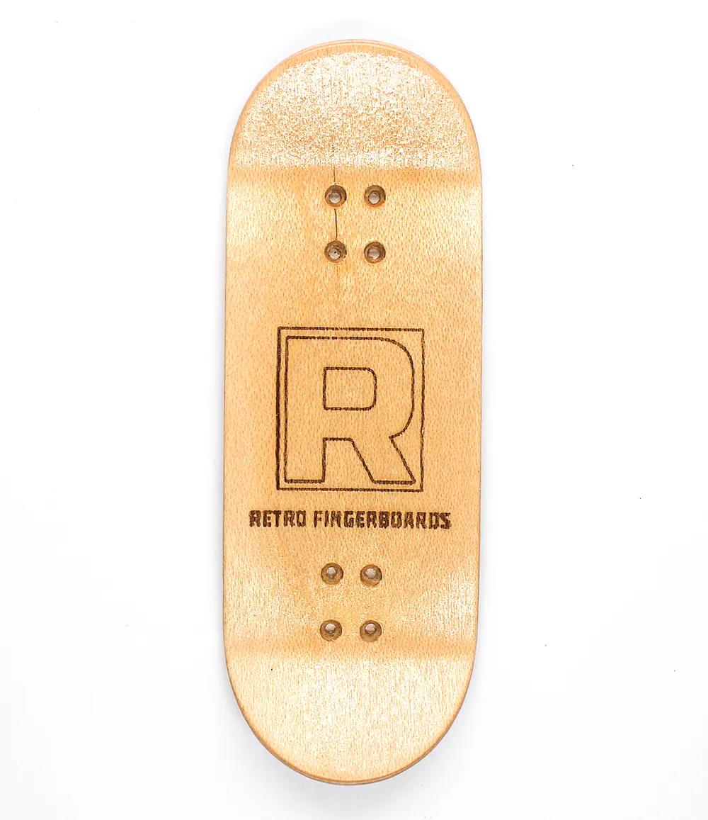 Natural maple wood fingerboard deck with "R RETRO FINGERBOARDS" logo, high kicks, and grip tape.